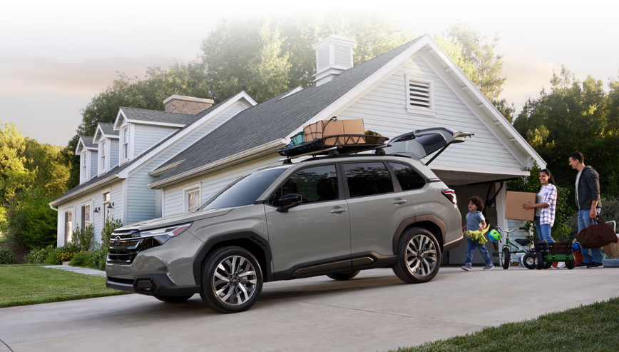 Webpage footer image of 2025 Forester Premier loading up on driveway.